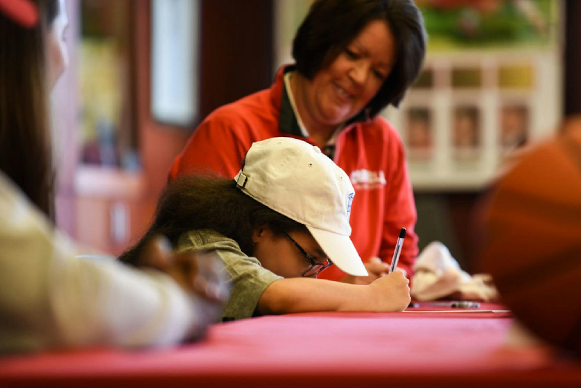 Karina Hill signs her