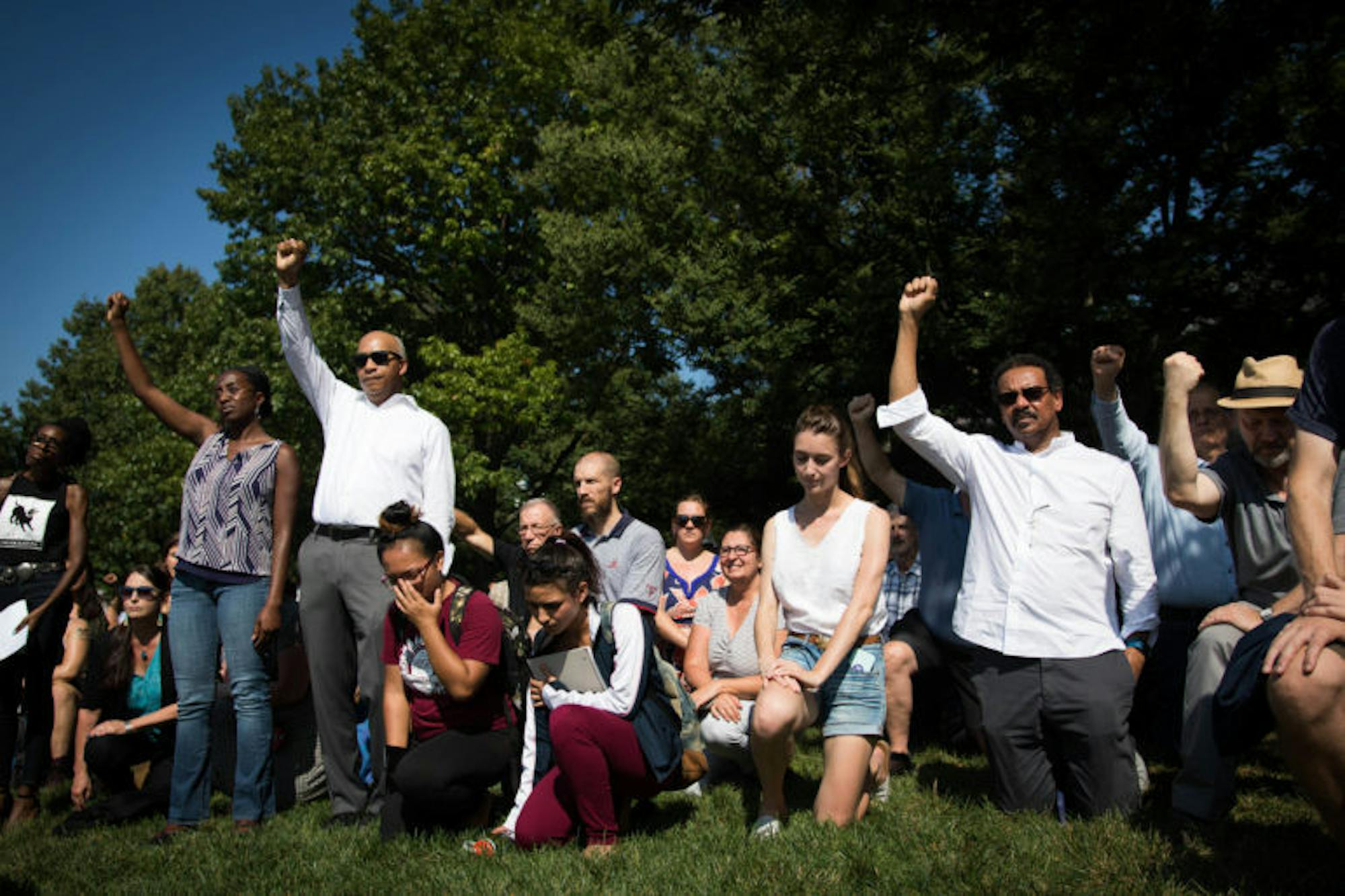 Hundreds of faculty, staff, students and Ithacans converge on the Arts Quad to take a knee against racism on Sept. 27, 2017 (Michael Wenye Li/Sun Assistant Photography Editor)