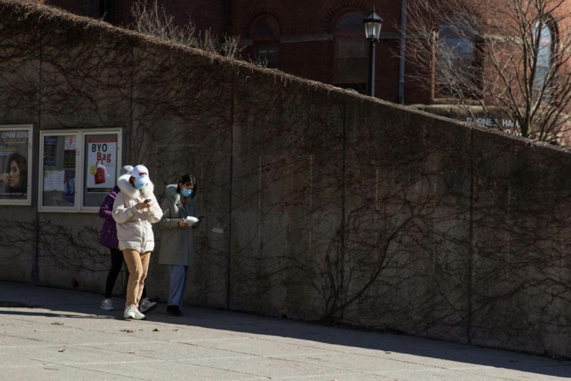 Student leave the Cornell Store wearing masks on March 13, 2020.