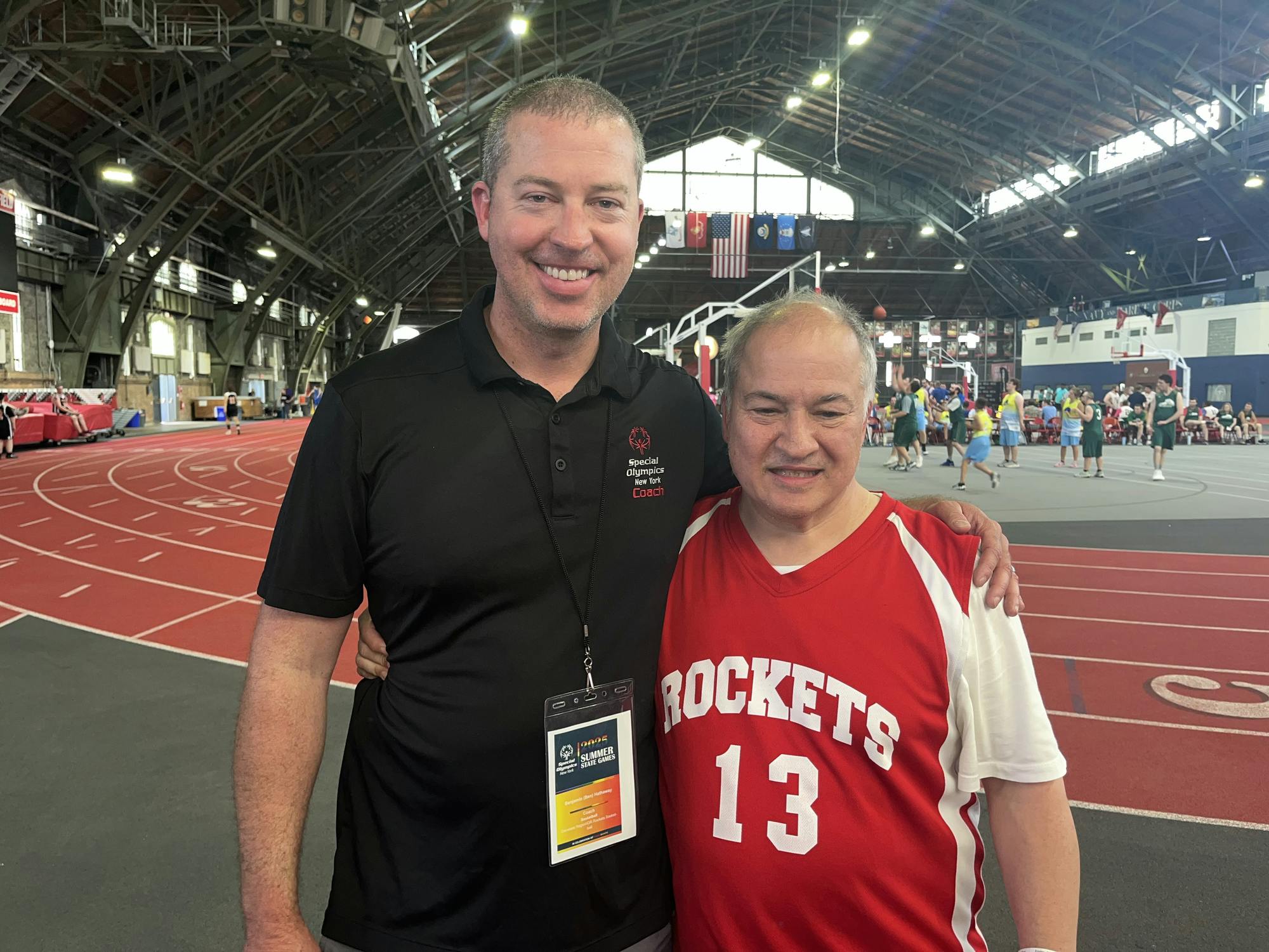 Wally Gee stands beside his coach, Ben Hathaway. The duo has known each other since Hathaway was young.