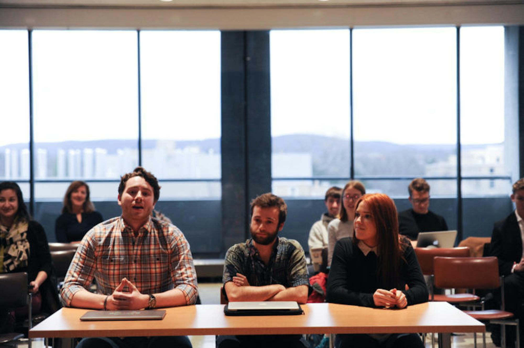 Tom Marin '17, August Larmer DiFilippo '17, and Rebecca Herz '18 speak at the SA Meeting on Thursday.