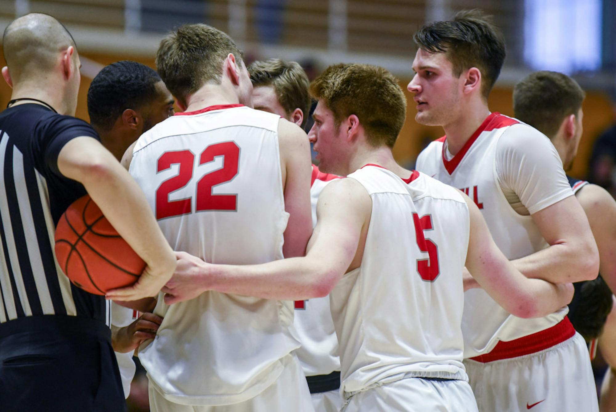 The Cornell men's basketball team confers after a foul call during the men's basketball game against Princeton on Saturday. The Red finished off strong for a victory against their Ivy League opponent. (Boris Tsang/Sun Photography Editor)