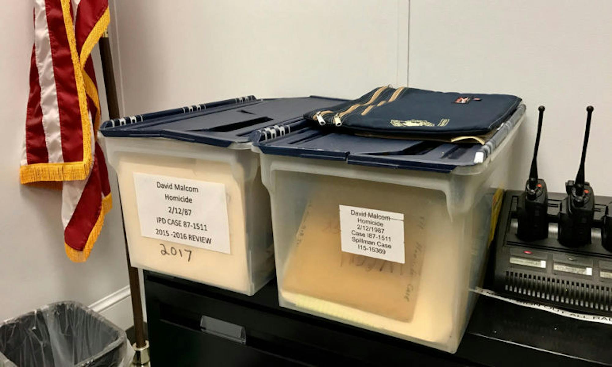 Two bins of notes related to the Malcom homicide investigation sit in Deputy Chief Vincent Monticello's office at the Ithaca Police Department