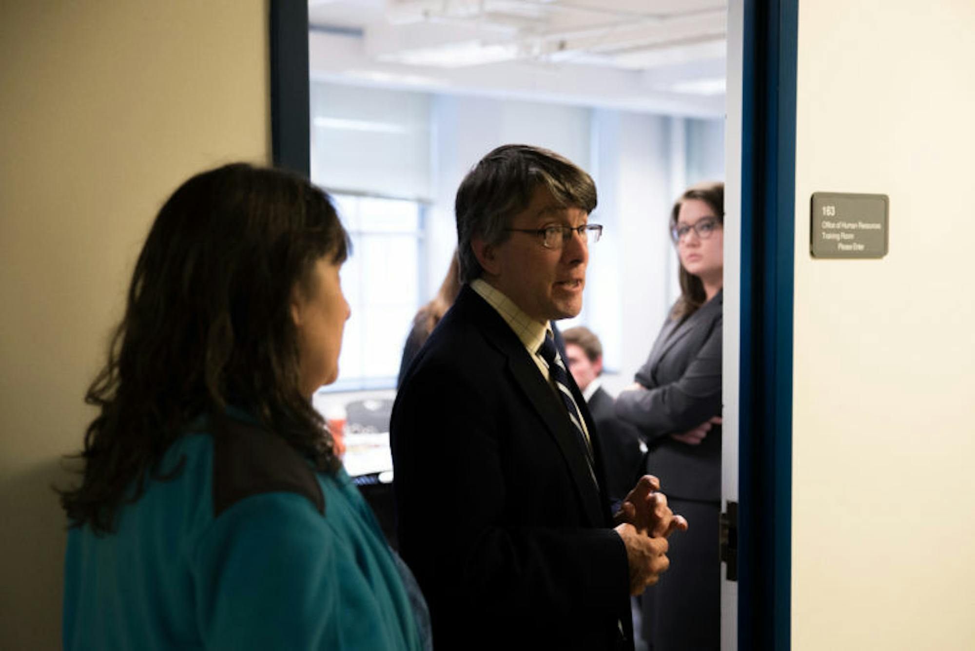 Prof. Timothy DeVoogd, the non-voting chair of the University Hearing Board, stands at the door of 163 Day Hall, where the hearing took place.