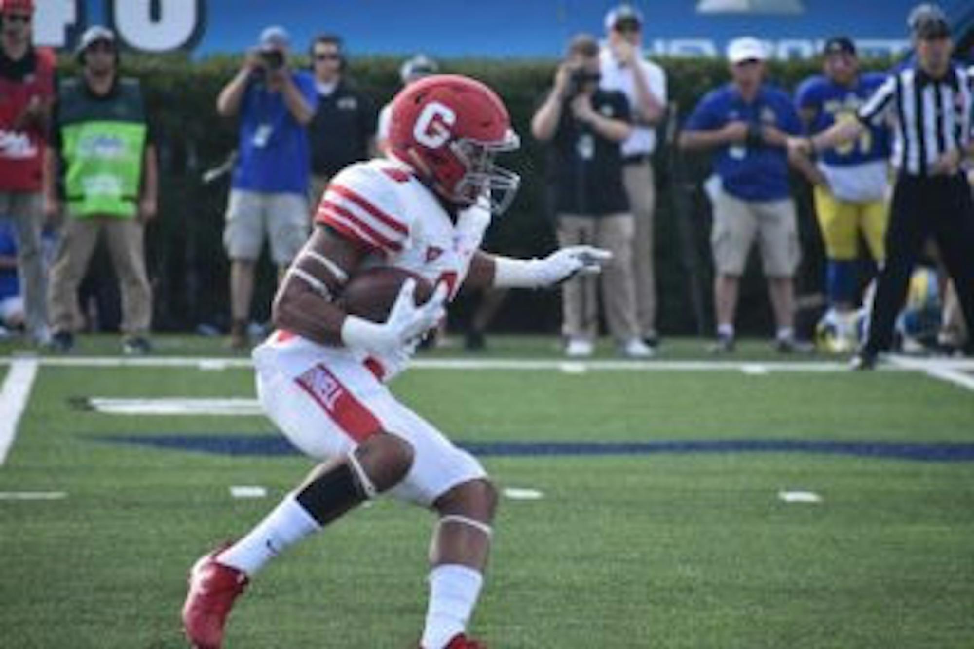 Running back Chris Walker, pictured above in the game against Delaware last season, is expected to return from injury this weekend.