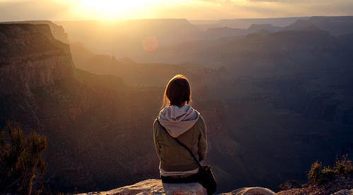 girl-sitting-alone-on-cliff