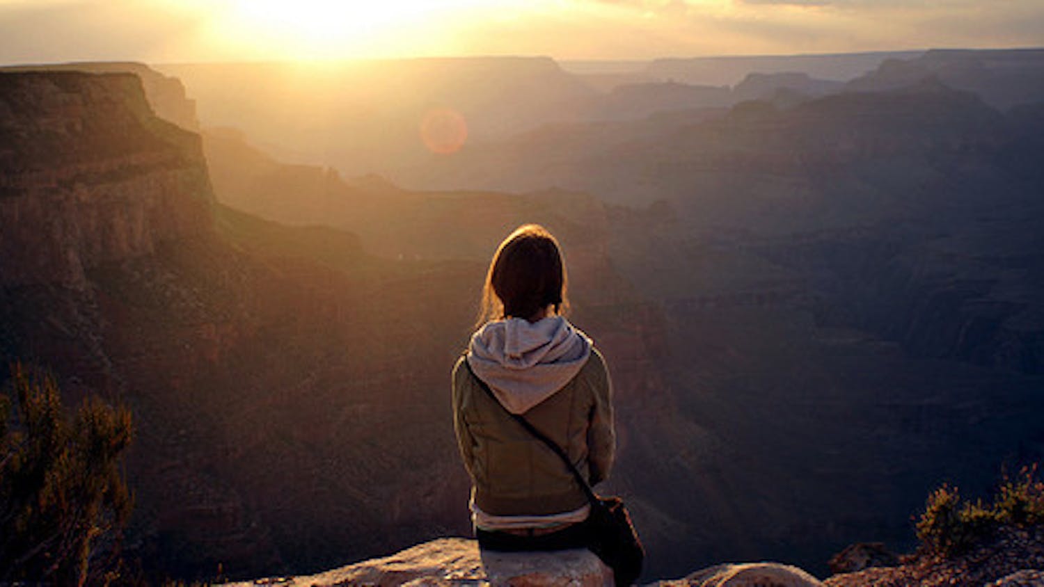 girl-sitting-alone-on-cliff
