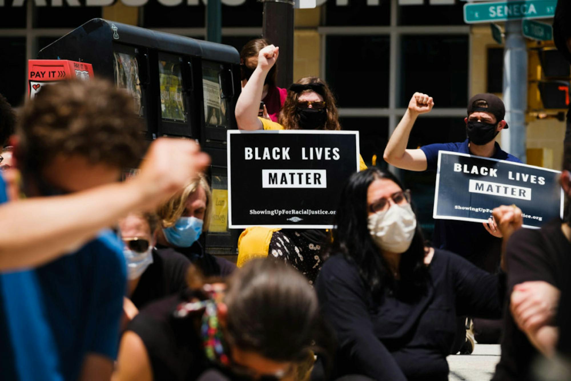 With the support of Black Lives Matter Ithaca, scores of students and Ithacans condemn white supremacy during Friday's rally. (Michael Suguitan / Sun Staff Photographer).