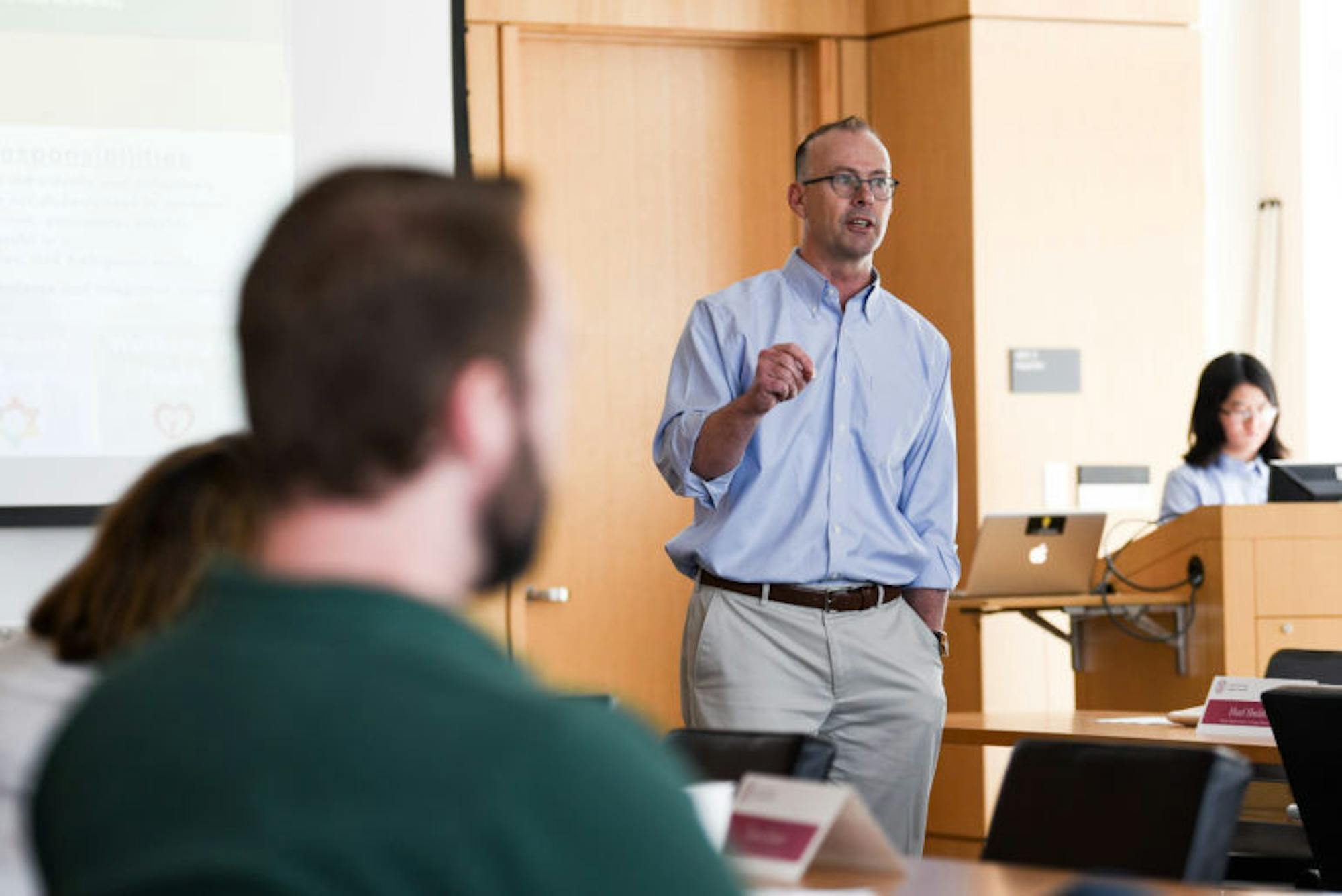 Craig Wiggers, chair and veterans’ representative at-large, speaks at the Employee Assembly meeting on Wednesday. Wiggers discussed the key issues identified by Leading Cornell, a leadership program for Cornell employees, that staff at Cornell face, including housing, community and well-being. (Boris Tsang / Sun Photography Editor)