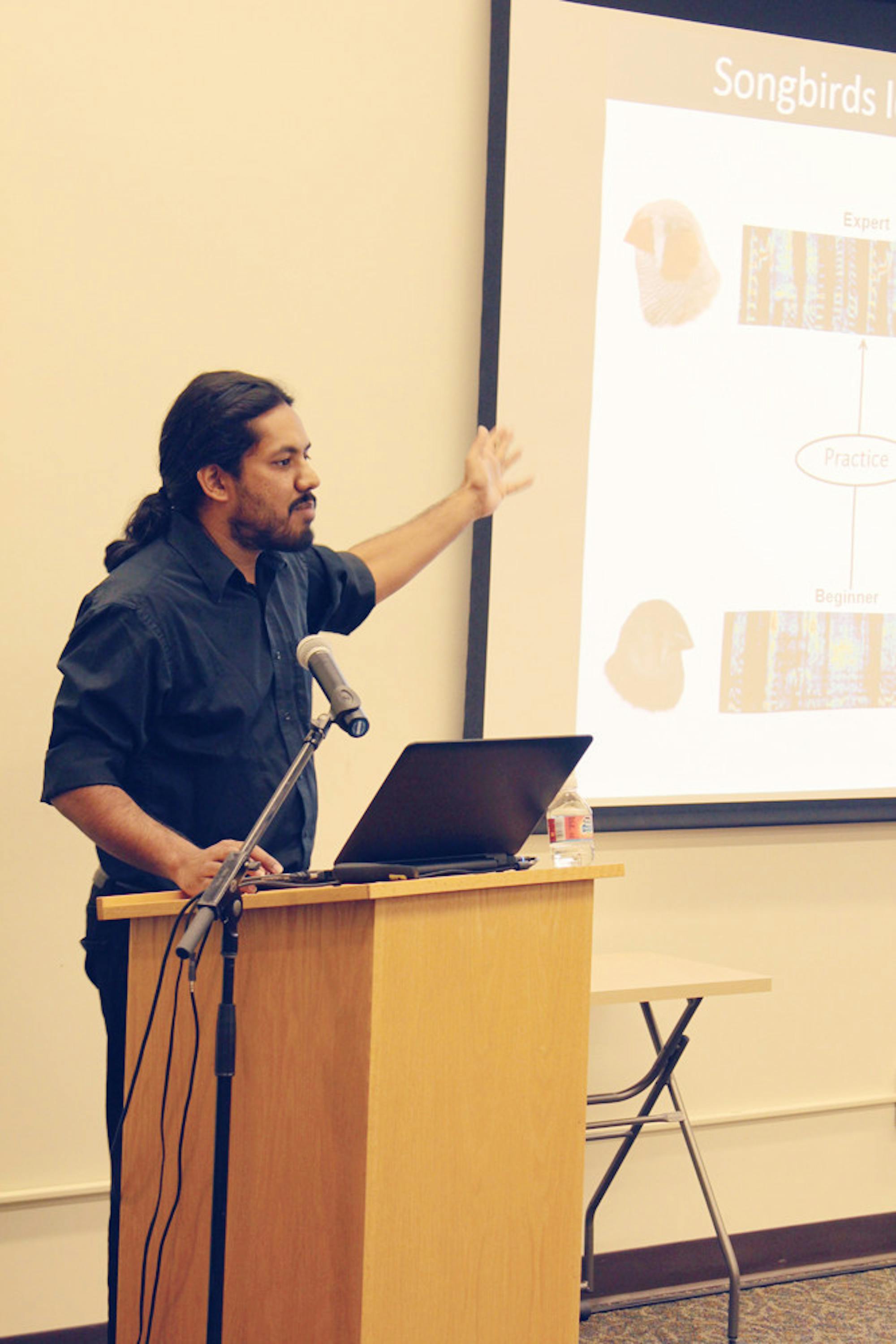 At the inaugural SPARK Talks event Thursday, Vikram Gadagkar discusses the clues given by songbirds in the environment. (Rula Saeed / Sun Staff Photographer)