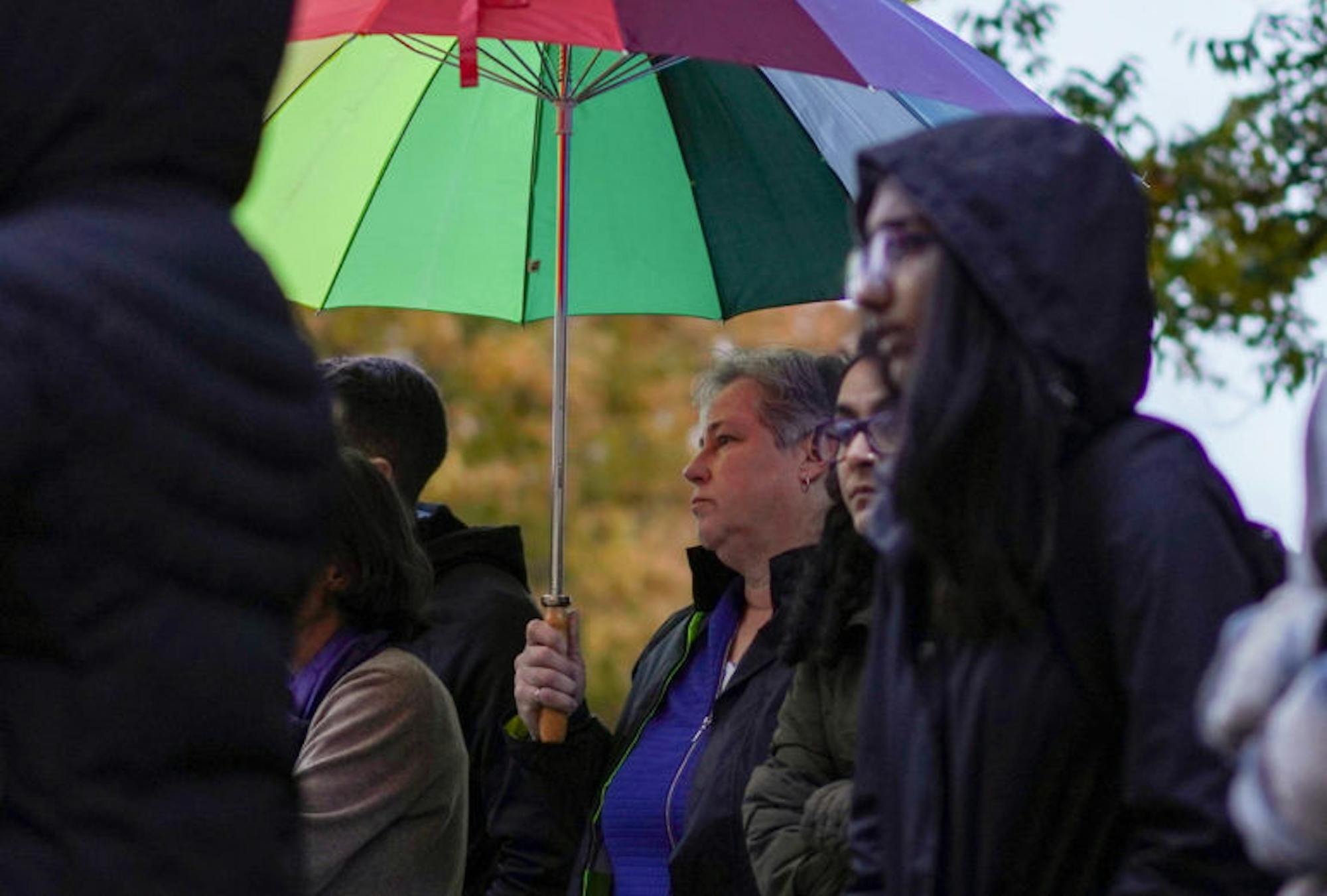 Despite the rain, over 100 community members gathered in front of Goldwin Smith Hall on Monday to show their support for transgender, nonbinary and gender nonconforming people. (Jing Jiang / Sun Staff Photographer)