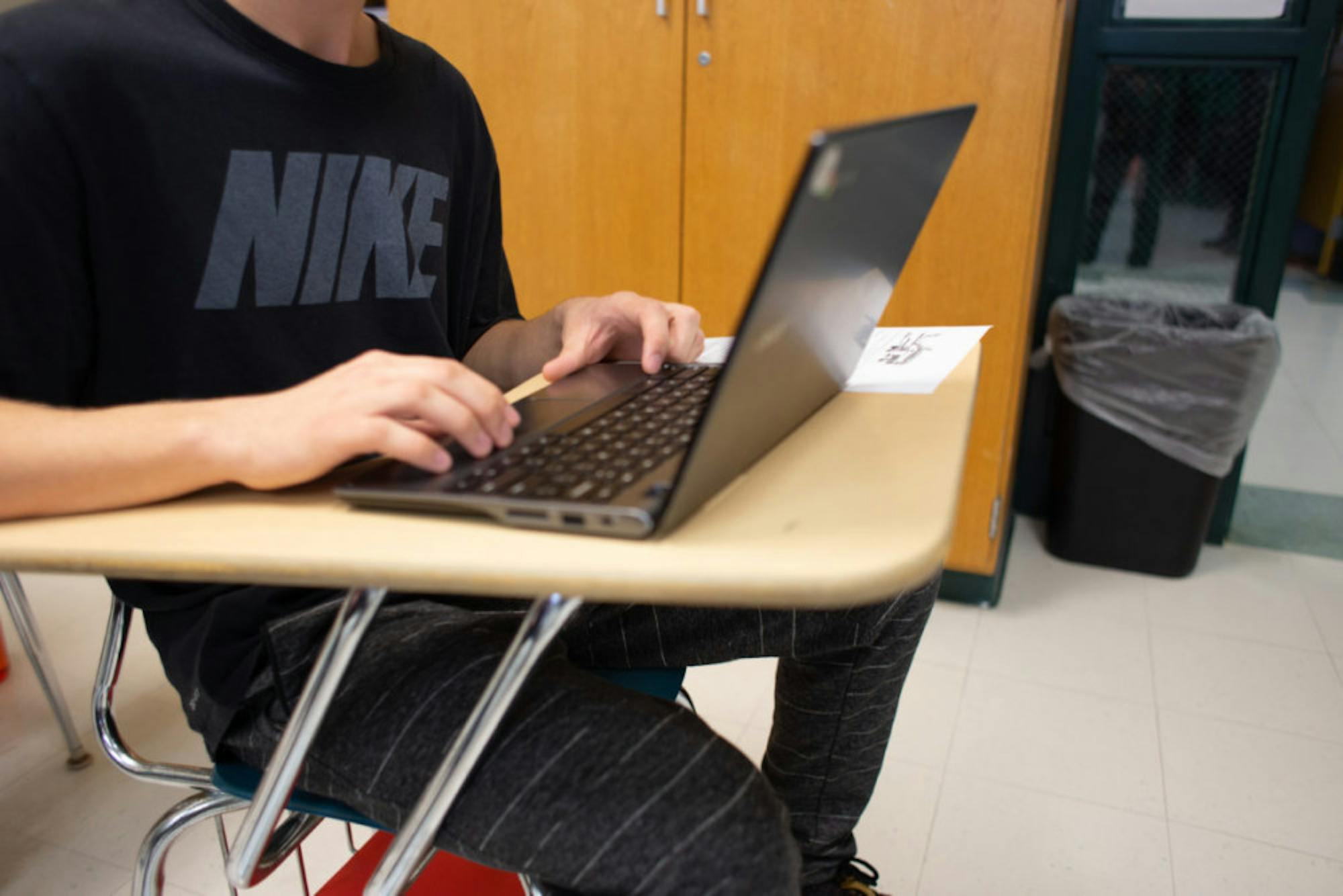 Coby Stuart puts the finishing touches on college applications. Like nearly all Wells students, he does not plan to apply to Cornell.