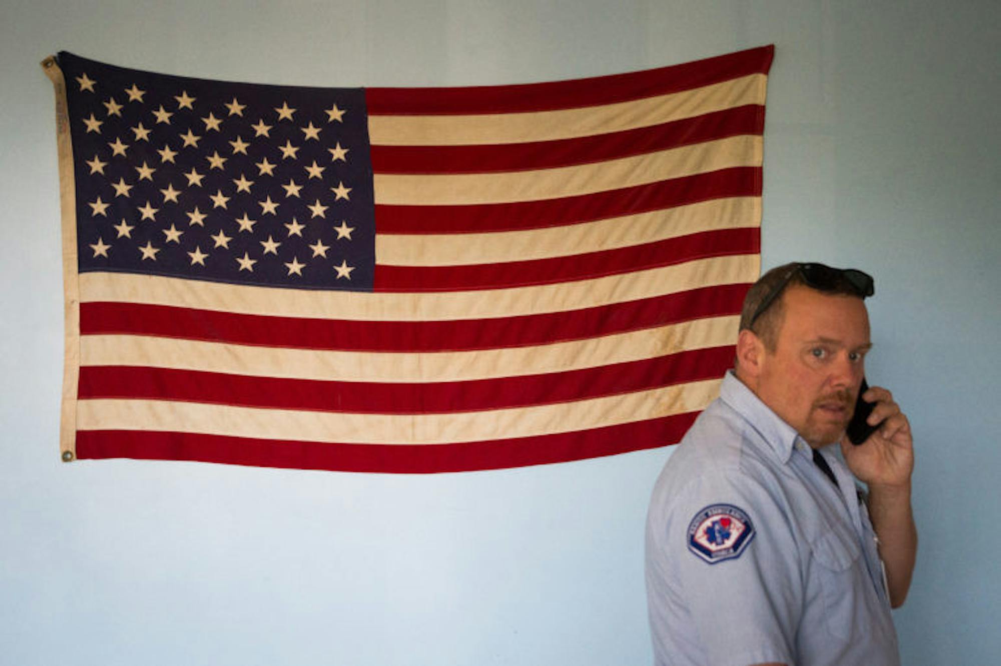 George Tamborelli, Chief of the Cayuga Heights Fire Department takes a call in the bunker common room on September 11th, 2017. (Cameron Pollack / Sun Photography Editor)
