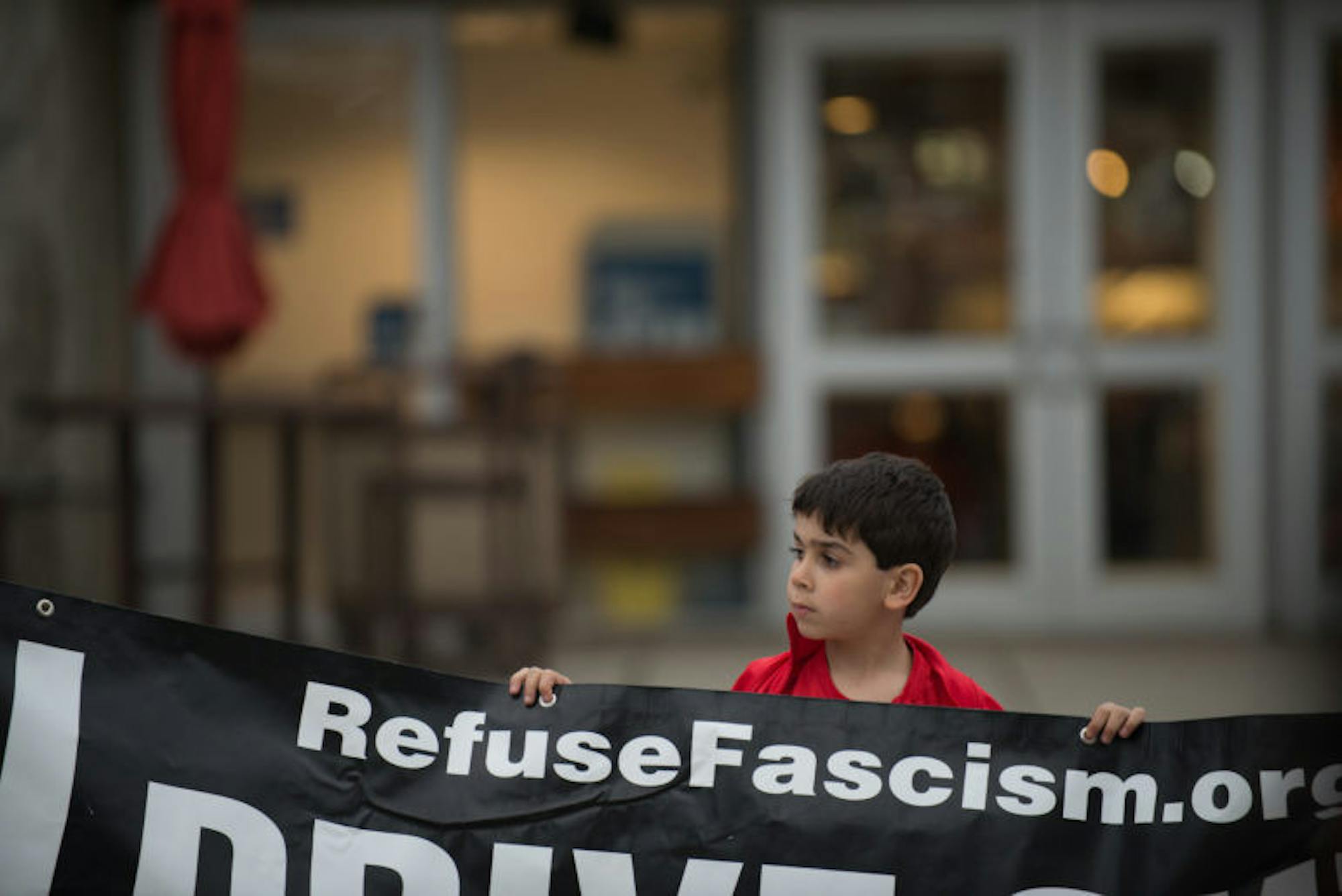 Abi Shamoun, a Syrian-American 6-year-old, accompanied his mother to a protest against the U.S. missile strike in Syria. It was about his 10th protest, his mother said.