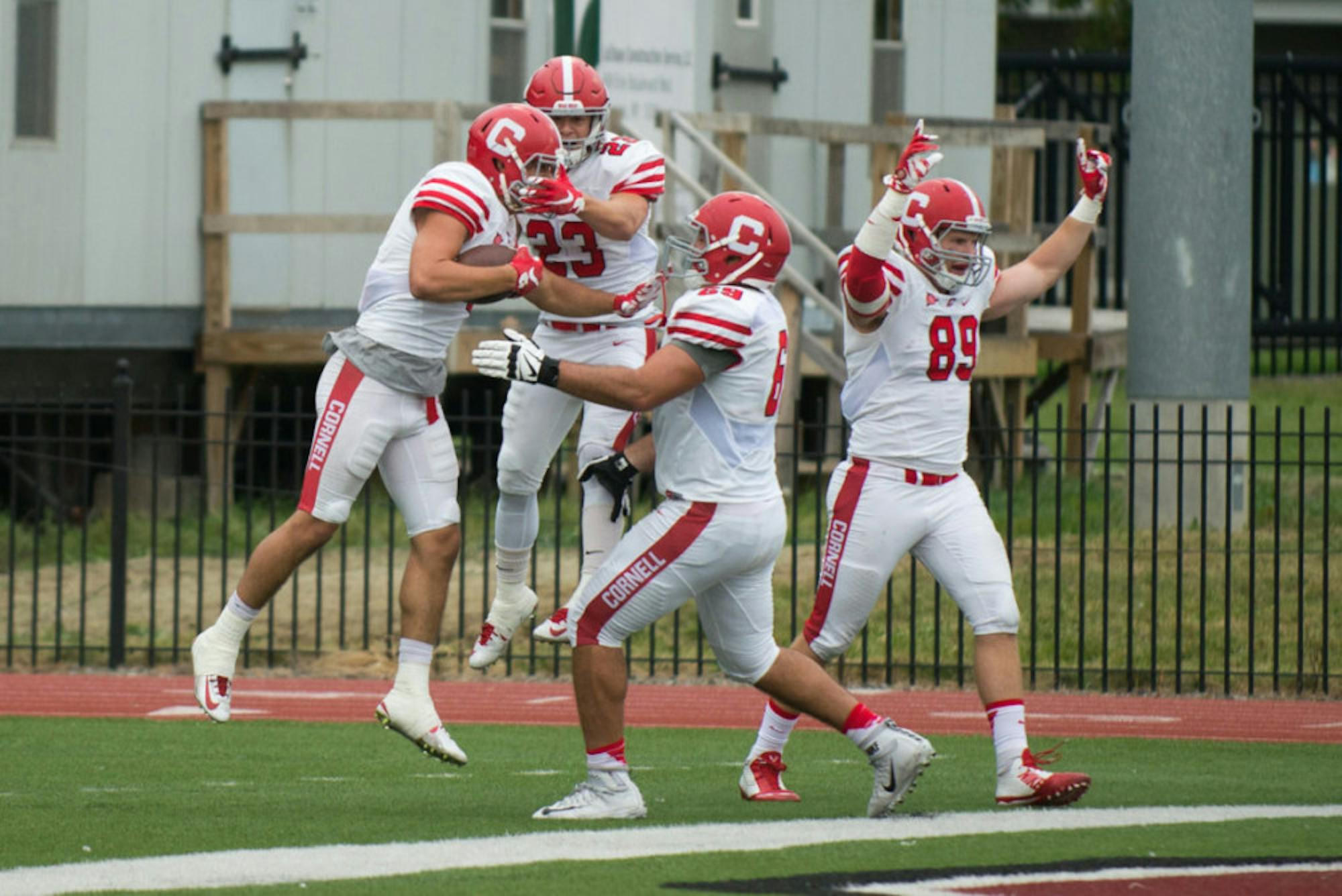Collin Shaw '16 (far left) and his teammates celebrate the game winning touchdown with under a minute remaining two years ago against Colgate.