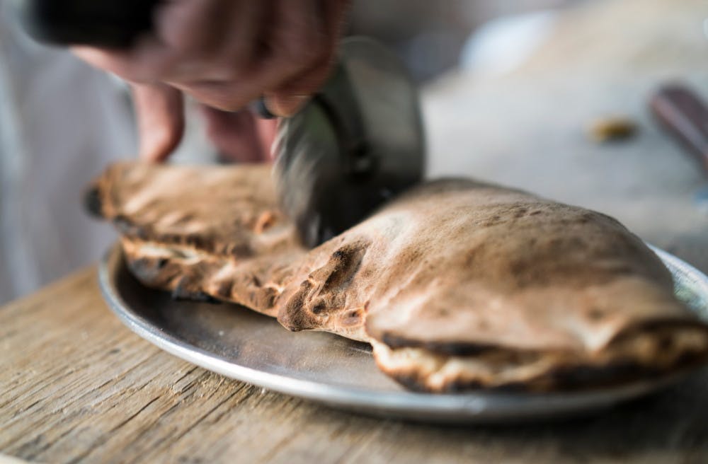 Pg-10-Dining-Calzone-Todd-Heisler-via-NYTimes