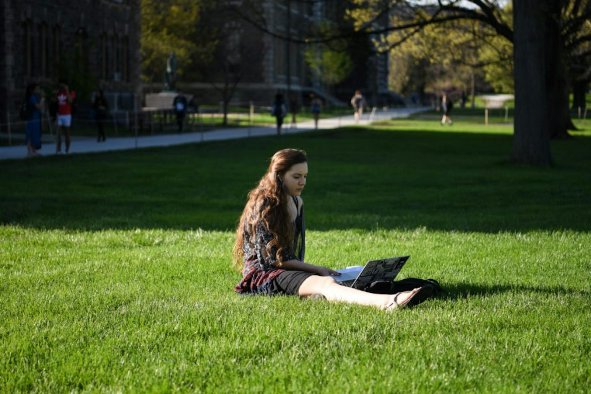Clara Ricketts '20 sitting on the Arts Quad.