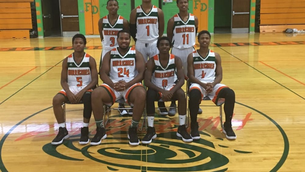 Frederick Douglass's Varsity Basketball team won their first game of the season, 52-51.