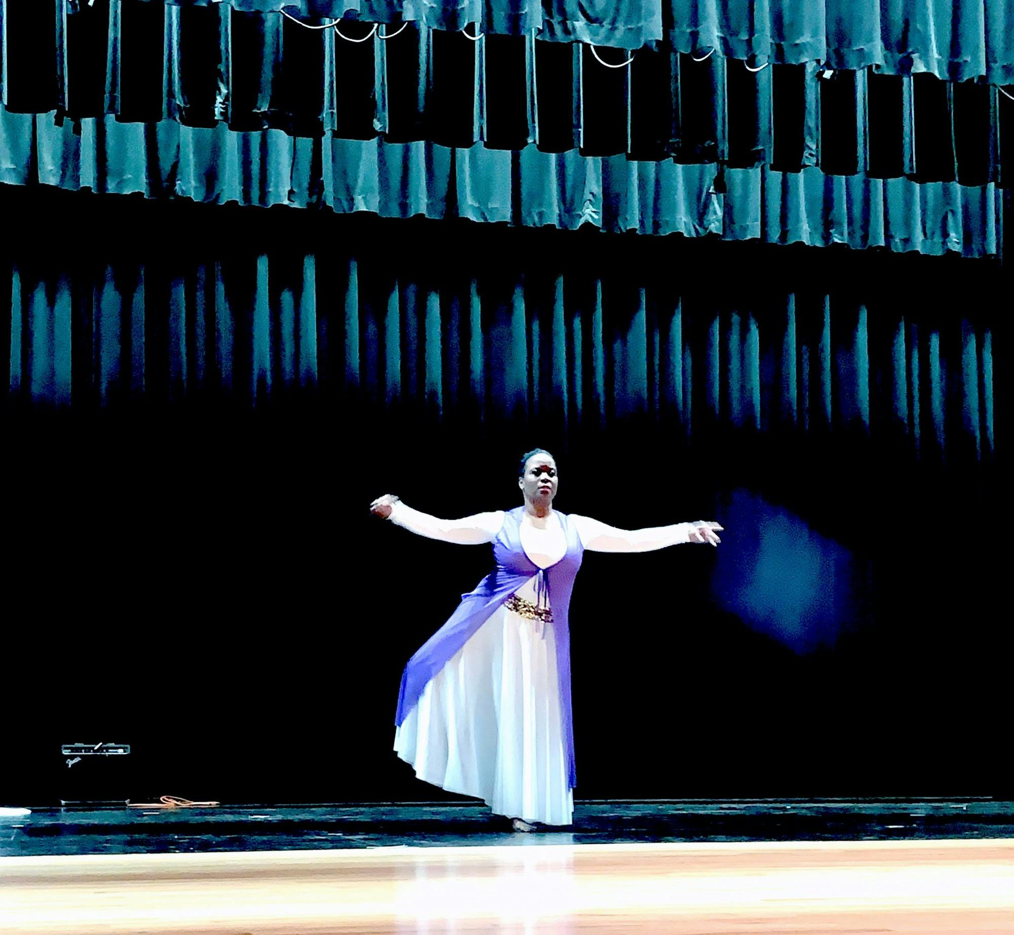 East English Village teacher Katrina Lewis-Rimmer dances during the talent show. Photo by Eric Major.