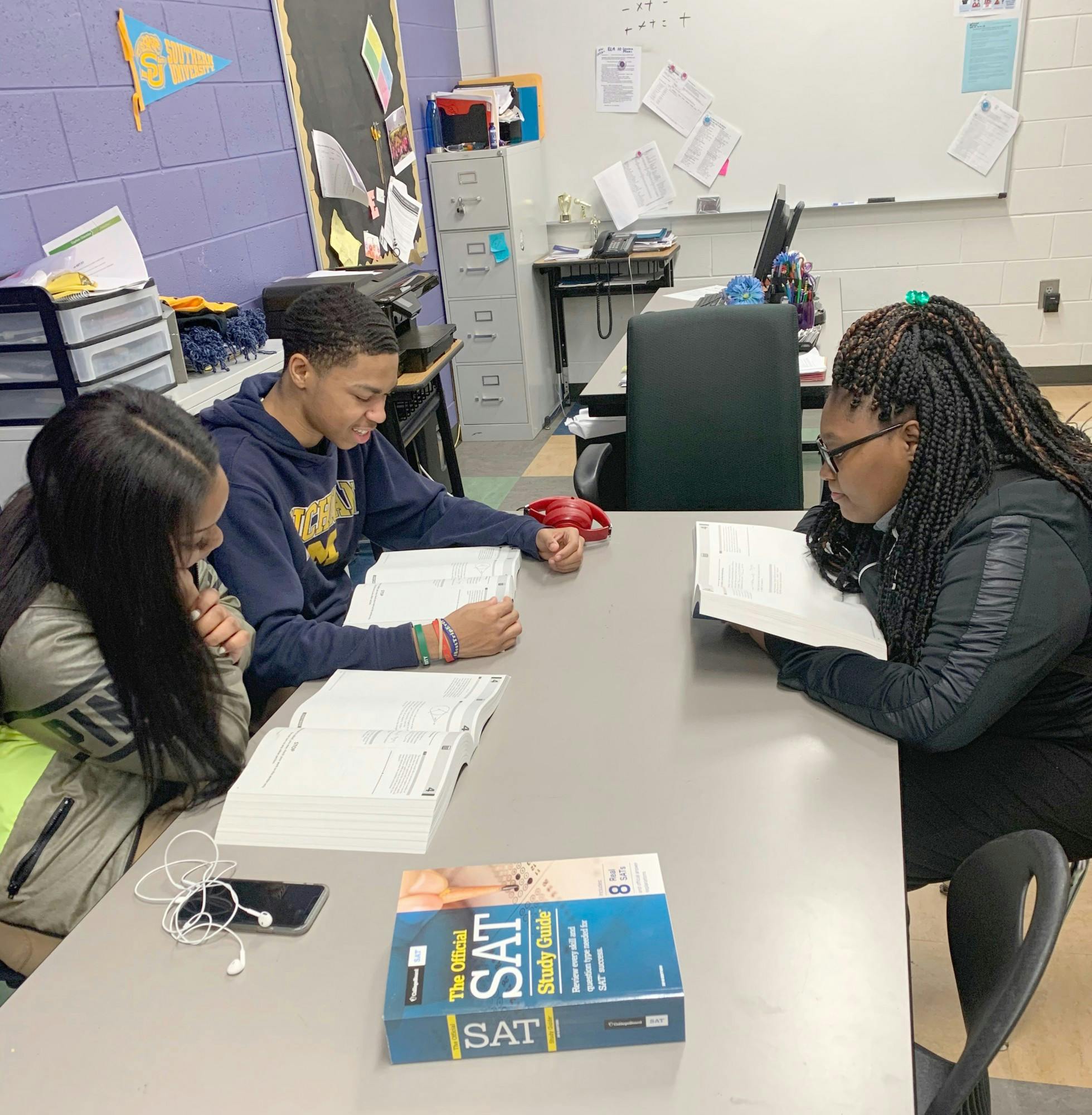 Students prepare for the SAT by reviewing study guides and taking Michael Gaston’s test prep class.