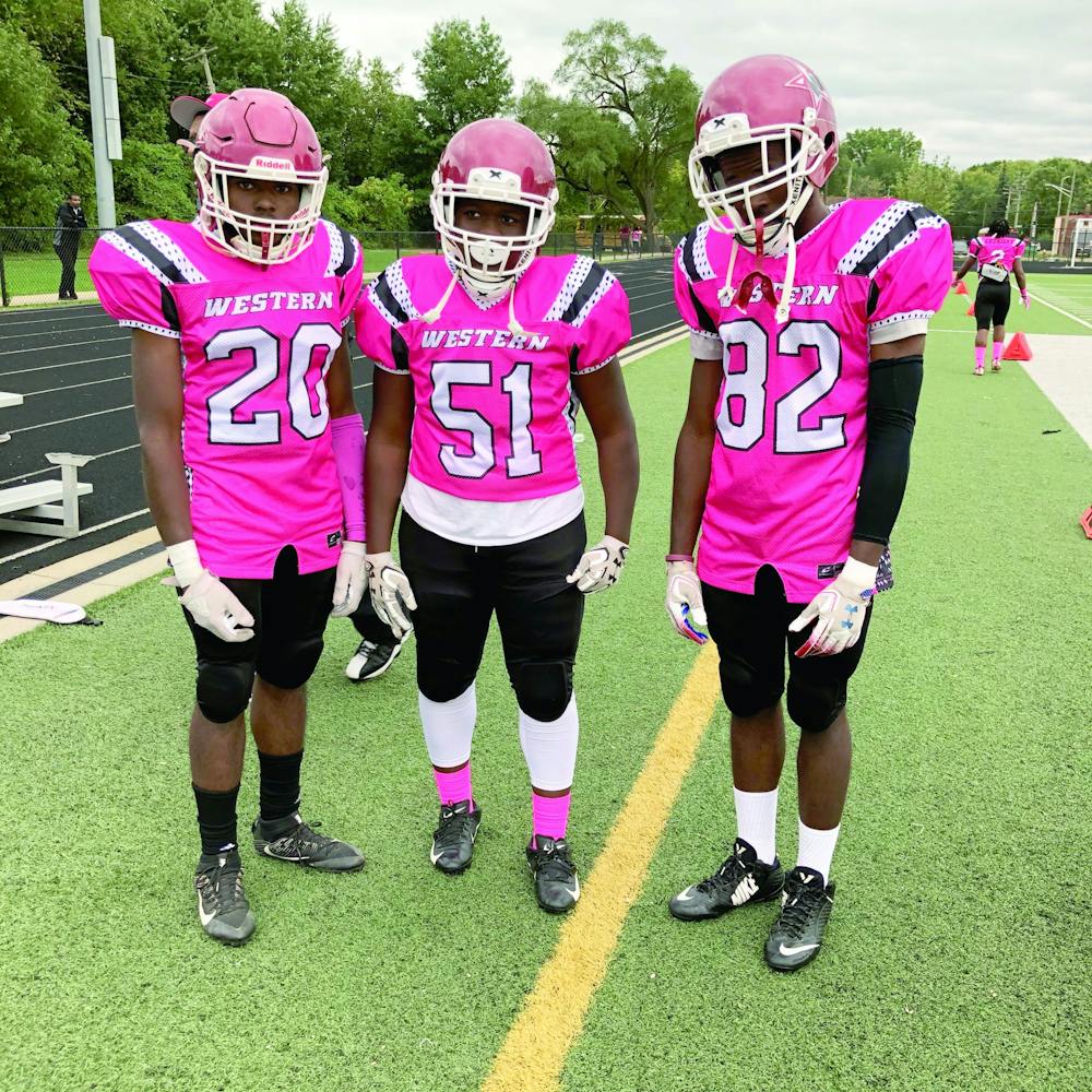 <p>Western football players Bryce Gates, Derrick McCain and Brandan Gates. Photo courtesy of Jonathan Washington.</p>