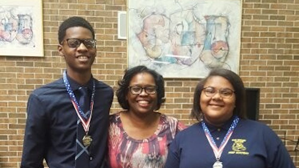 Nikolas Huey and Kharriane Gray pictured with Allayne Woods at a the Palazzo Strozzi Foundation Scholarship Banquet. Woods inspired both Huey and Gray to submit essays for the opportunity to travel to Italy.