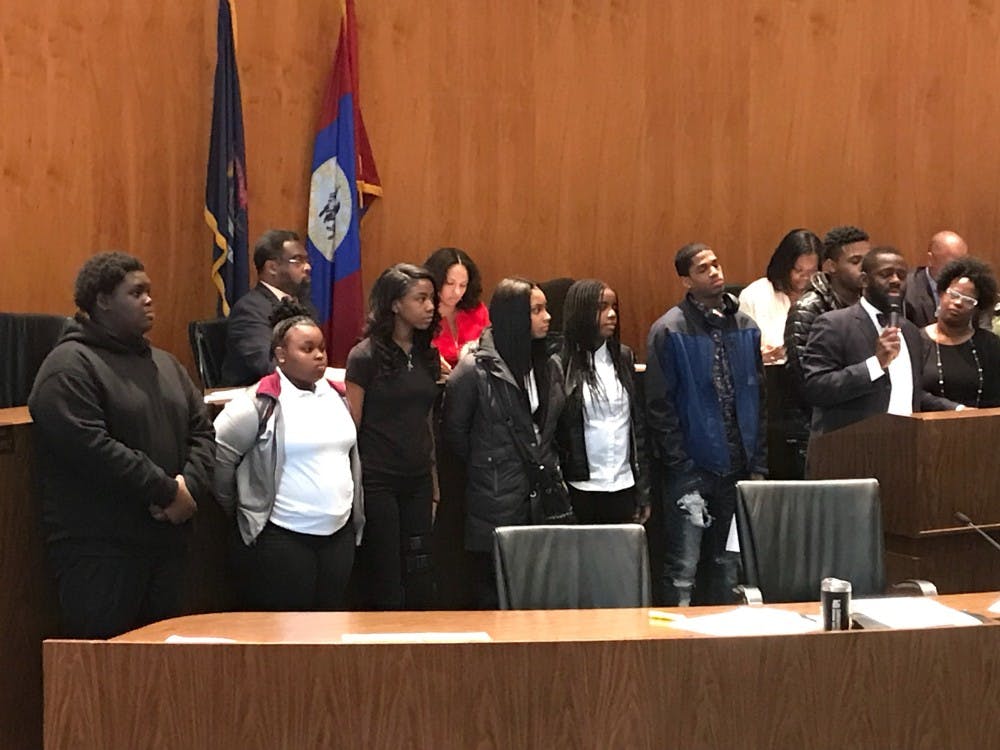 <p>Southeastern students (far left) Christopher Blake, Jada Brewer and Lauren Reed listen to Detroit City Councilman Andre Spivey. </p>
