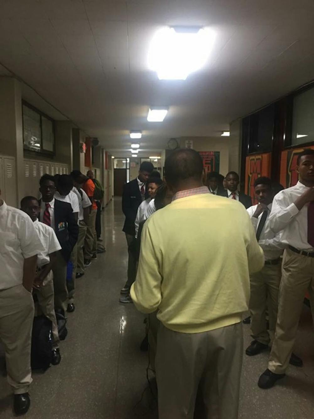 <p>9th Grade students listen to Dennis Talbert speak during community time. </p>