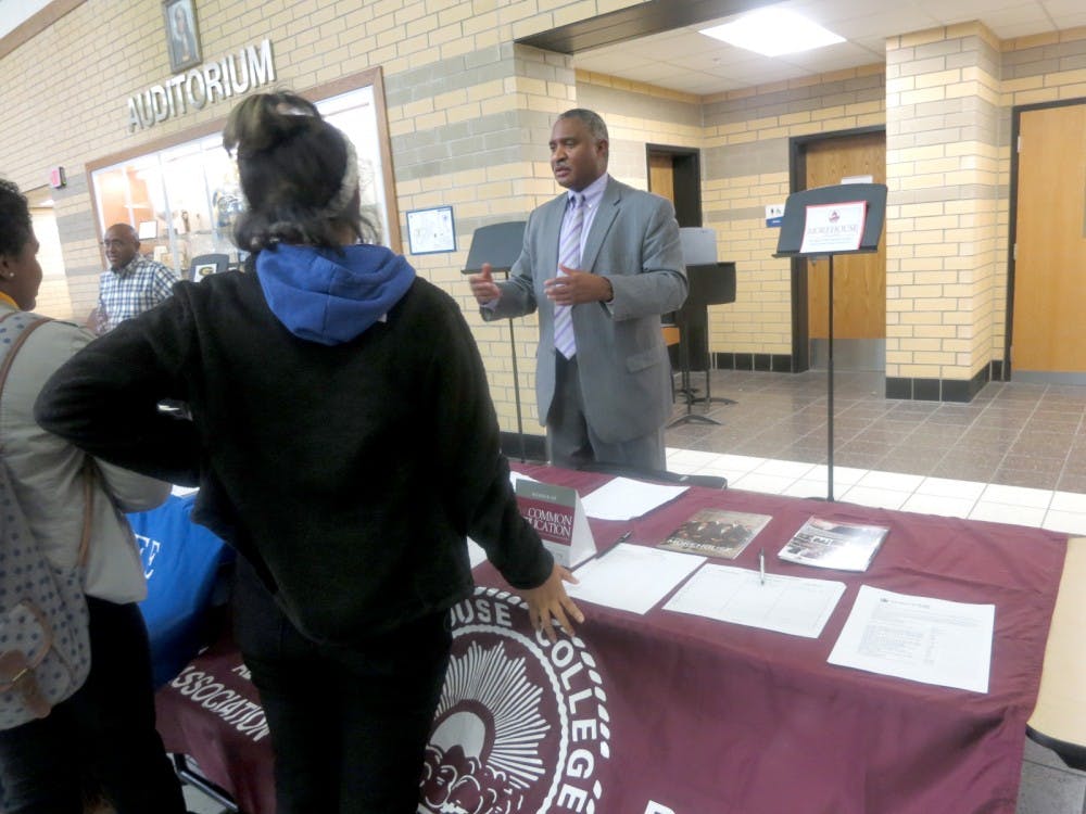 A Morehouse College recruiter speaks to students at an East English Village Preparatory Academy college fair. File photo by Voice of the Ville staff.