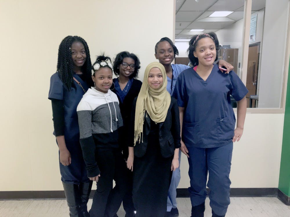 <p>BCHS junior Peer Wellness Coaches Kemi Dauda, Amber McIntosh, Suma Taher, and Nadia Dearing, pictured with their mentees, Jayla Newborn and Roeisha Waller.</p>