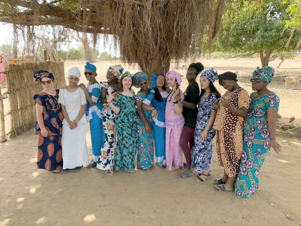 <p>The buildOn trek team poses for a photo before the farewell dance from the village of Deffame, Senegal, West Africa, in April. Courtesy photo.</p>