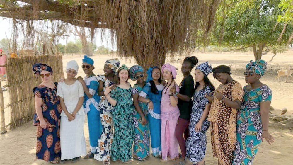 The buildOn trek team poses for a photo before the farewell dance from the village of Deffame, Senegal, West Africa, in April. Courtesy photo.