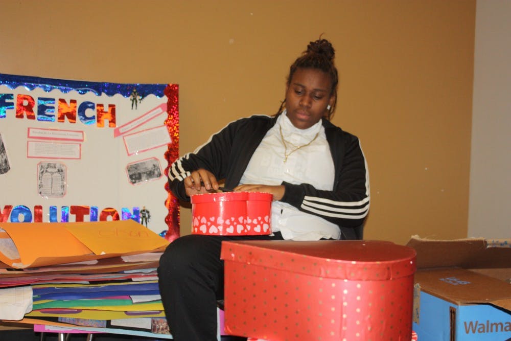 Student Government Senior Erica Pruitt preparing gifts for the Valentine's Day promotion.