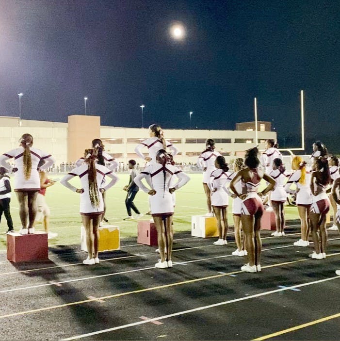 RHS cheerleaders on the sidelines rooting on the RHS varsity football team. Courtesy photo.