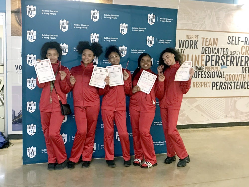 Some of the girls from University Prep Academy volleyball team with pencils.