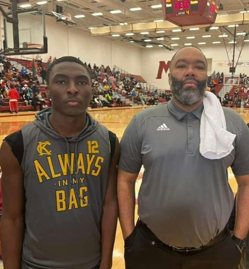 <p>Shooting guard Lamont Parks and varsity basketball coach George Ward after the Muskegon 2022 Basketball Showcase. Courtesy photo.</p>