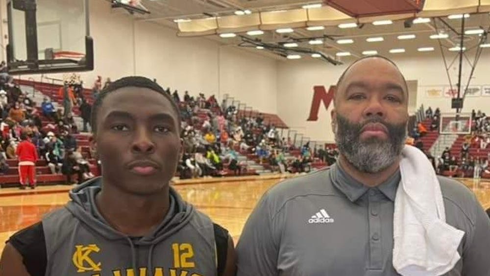 Shooting guard Lamont Parks and varsity basketball coach George Ward after the Muskegon 2022 Basketball Showcase. Courtesy photo.