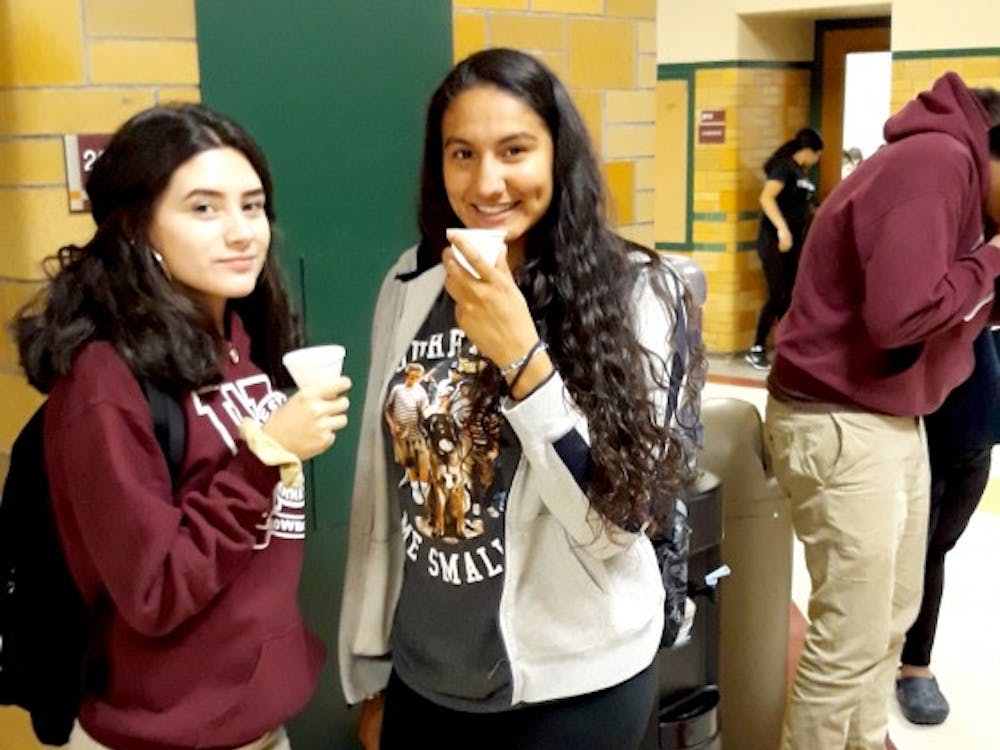 Sophomores Ceslia Galindez and Frida Diaz stop to grab a drink at one of the many water coolers available in the halls of Western.