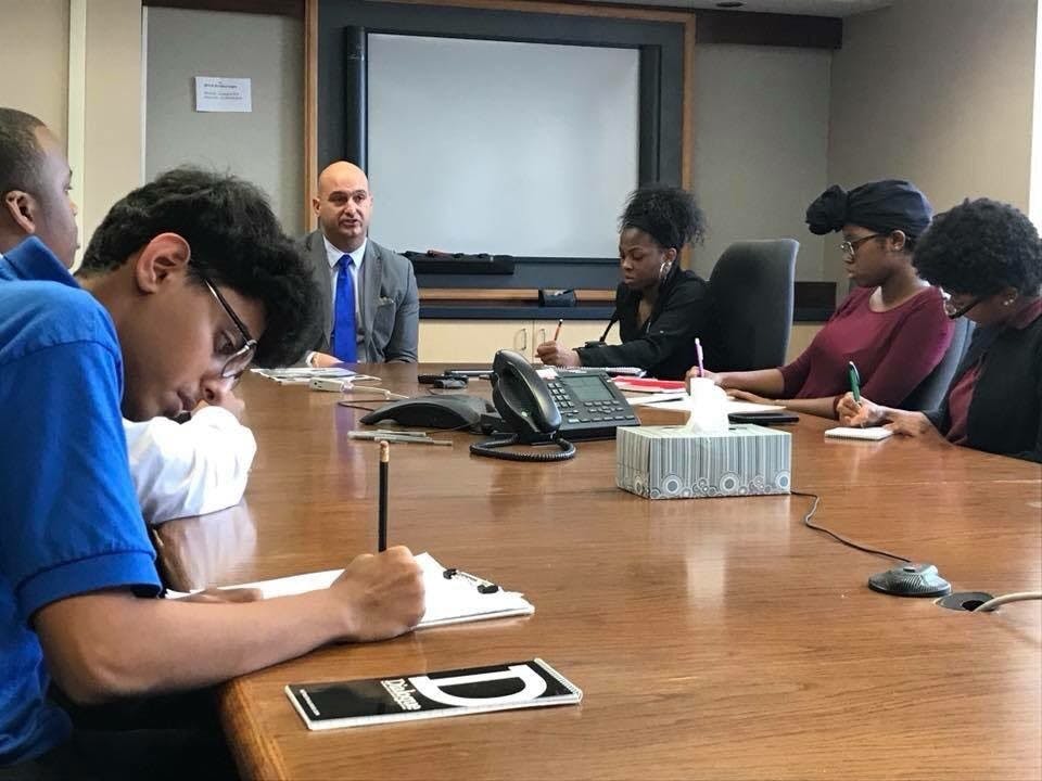 Osama Aldahan, reporter for the Benjamin Carson Diagnostic, and other Dialogue reporters take notes while interviewing Superintendent Vitti.&nbsp;