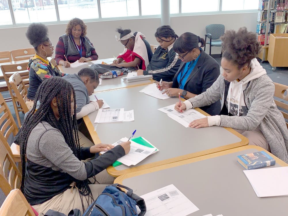 Mentors Arvis Williams and Norma Jean Evan show their mentees the proper steps of career planning.