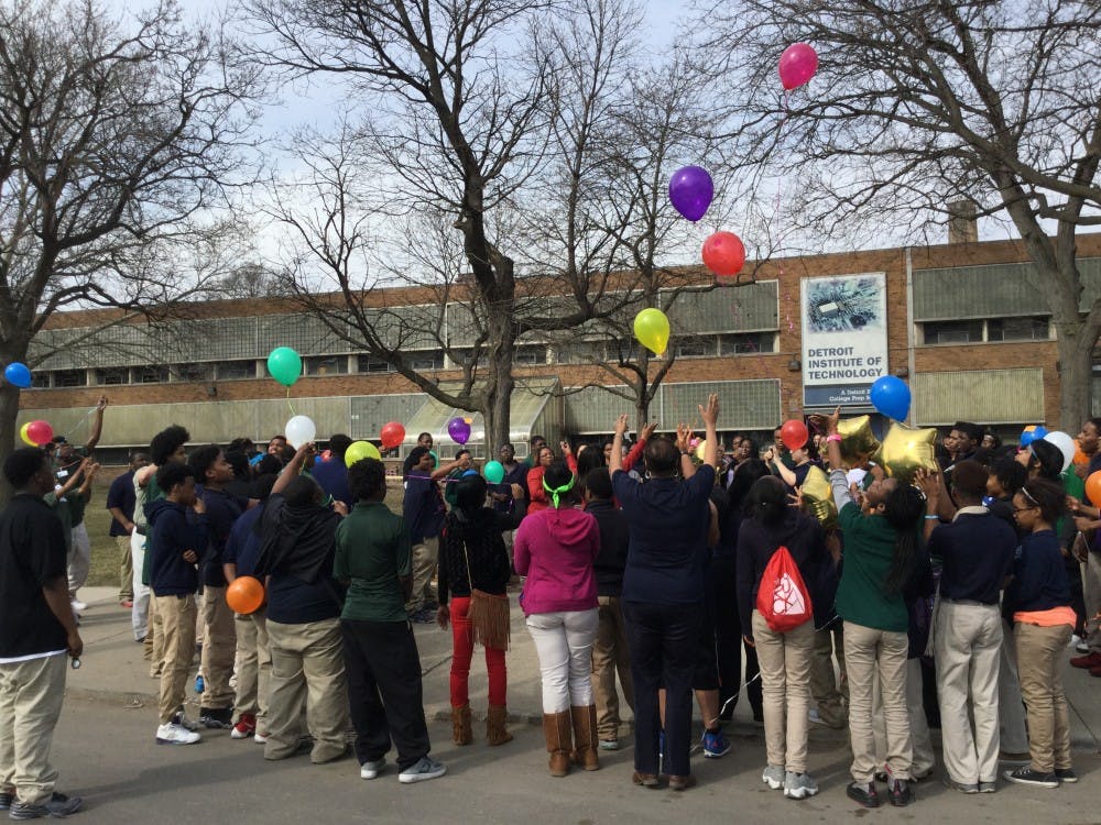 DIT students and staff release balloons at the end of a Mar. 9th gathering to honor school social worker Deborah Cahee who died on Mar. 2.