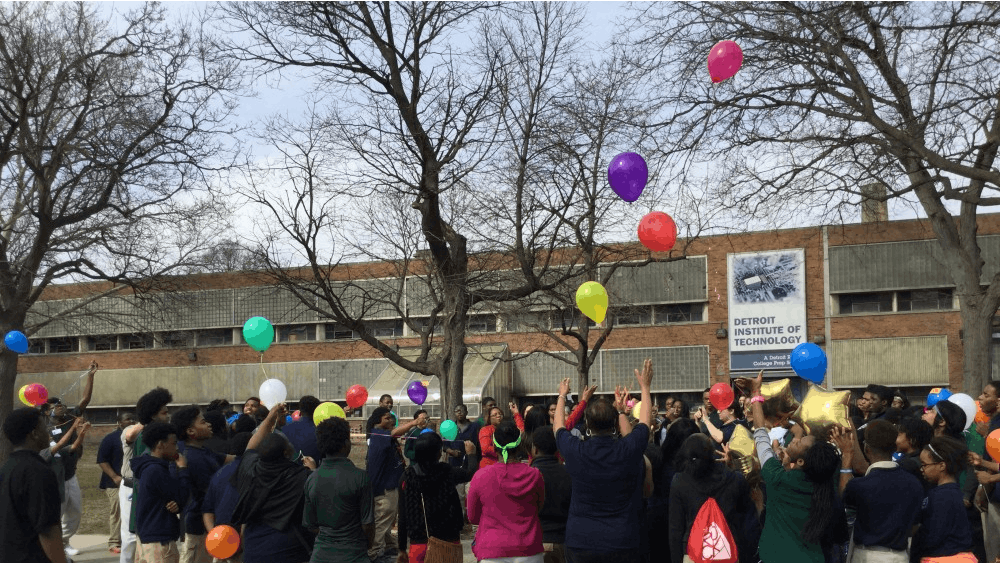 DIT students and staff release balloons at the end of a Mar. 9th gathering to honor school social worker Deborah Cahee who died on Mar. 2.