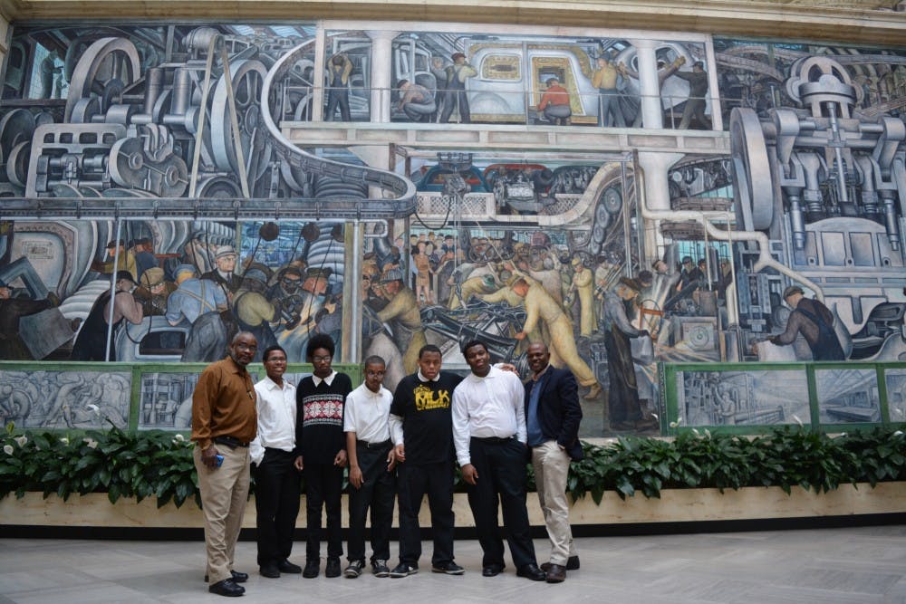 Teacher Eti Umana (far right) and paraprofessional Reginal Jones (far left) allow their students to experience the Detroit Institute of Arts.