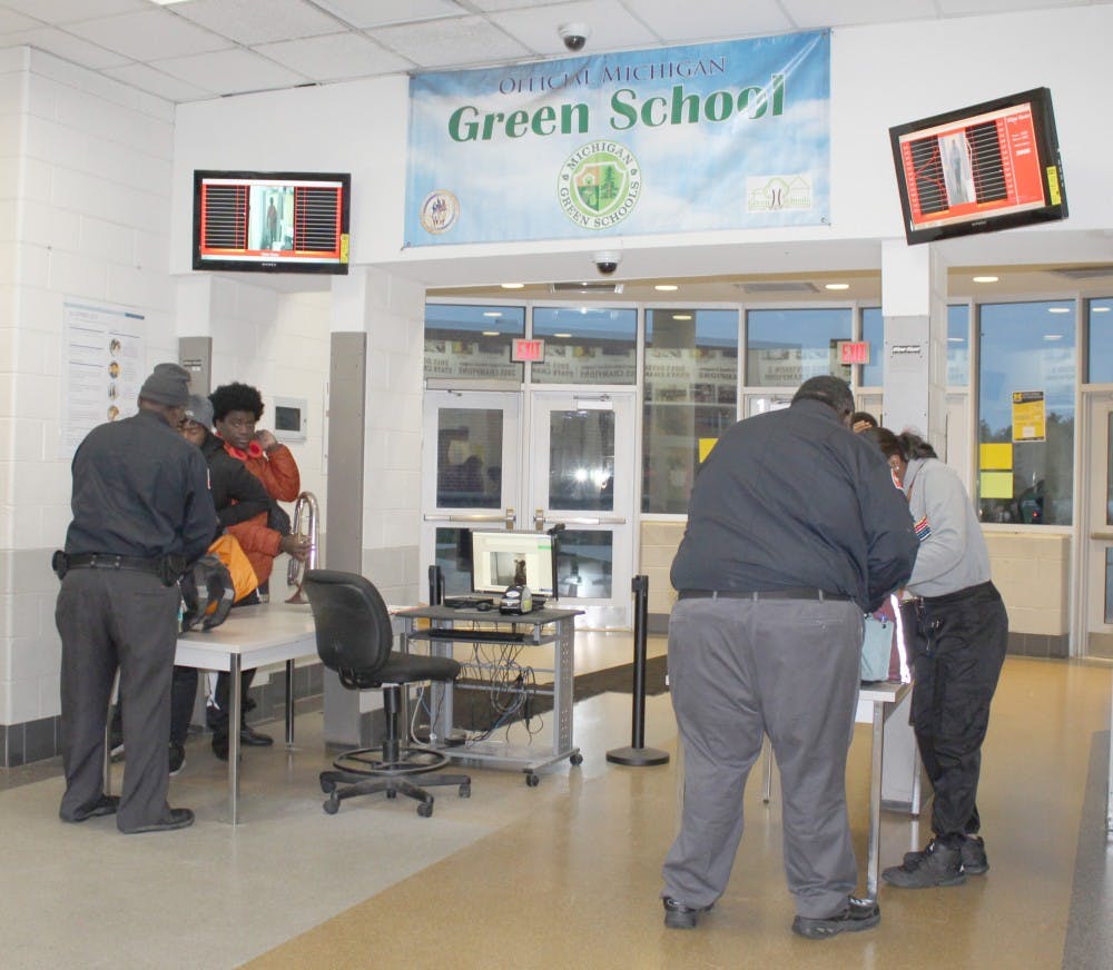 <p>Security staff checks students and adults as they enter the building through metal detectors. This and other procedures are in place to ensure safety.</p>