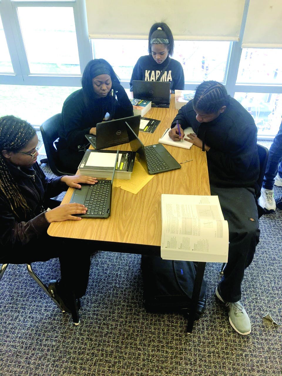 Kenya Johnson, Shantel Morrow, Mar’Tya Remson and Victor Williams work on SAT prep in Ms. Johnson’s class.