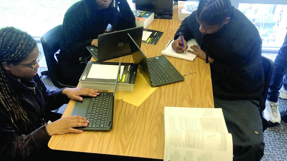 Kenya Johnson, Shantel Morrow, Mar’Tya Remson and Victor Williams work on SAT prep in Ms. Johnson’s class.