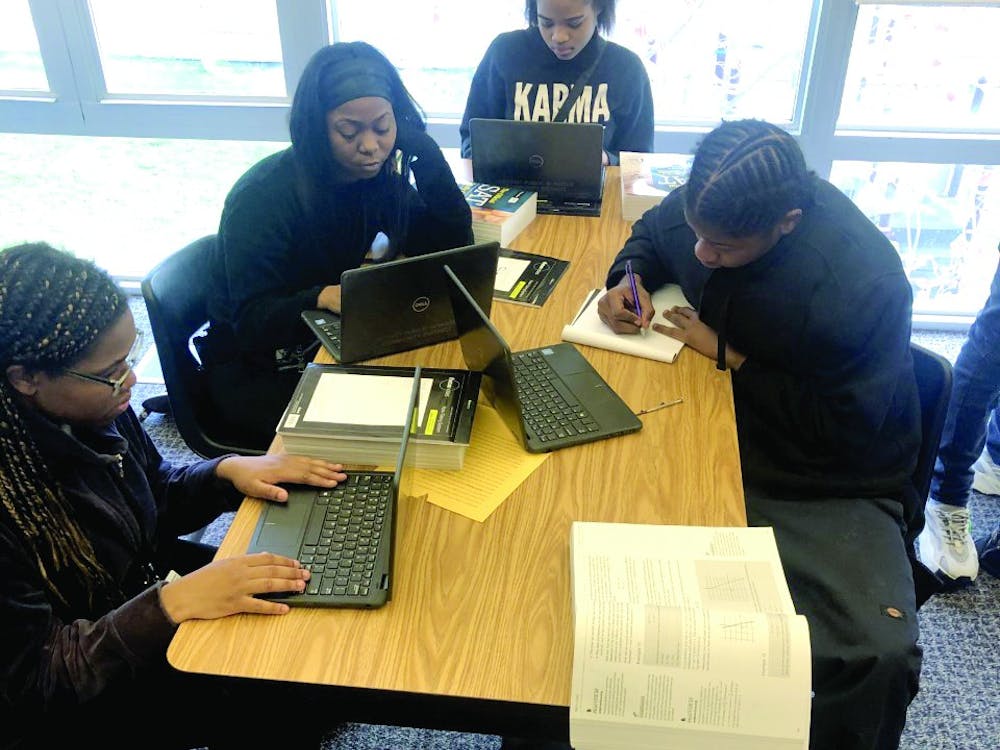 Kenya Johnson, Shantel Morrow, Mar’Tya Remson and Victor Williams work on SAT prep in Ms. Johnson’s class.