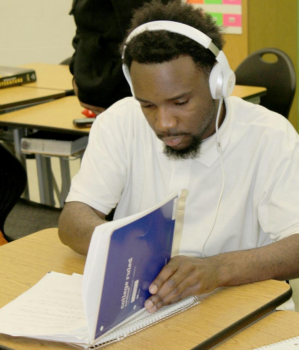 <p>King junior Collin Blanford arrives to class daily with his headphones to help him focus.</p>