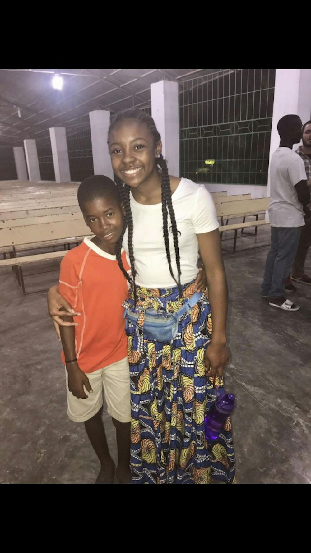 <p>Sade’ Ried and village boy attending Mission of Hope’s Church.&nbsp;</p><p>Photo Credit: Aaron Donaghy Avondale High School teacher </p>