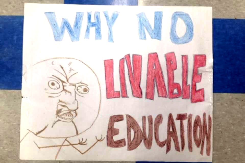 Detroit International Academy senior Hawa Rahman created protest signs, including this one. She said&nbsp;does not believe officials are applying enough effort towards fixing the facilities.
